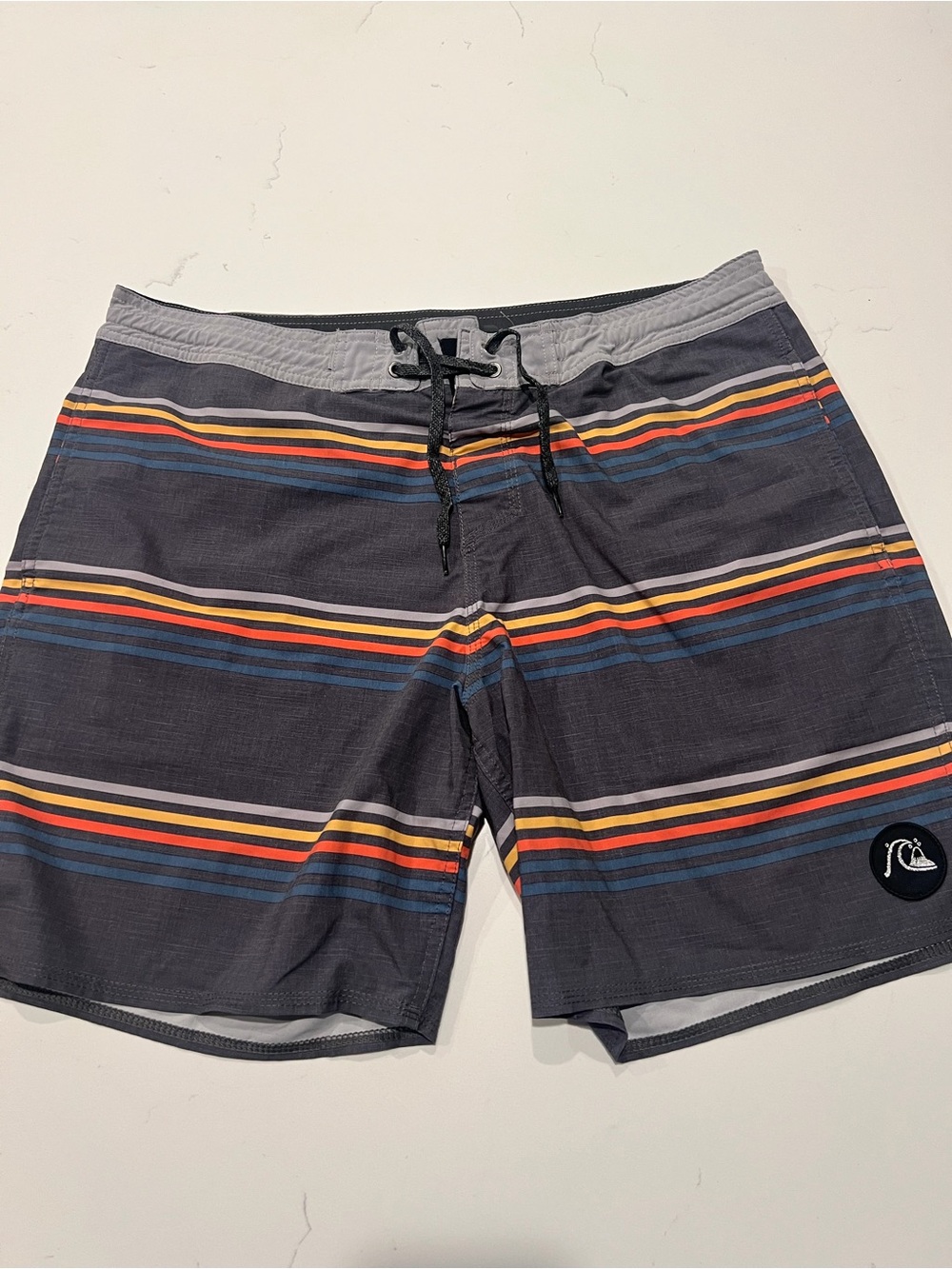 Quiksilver Gray Board Shorts with Blue, Orange & Yellow Stripes